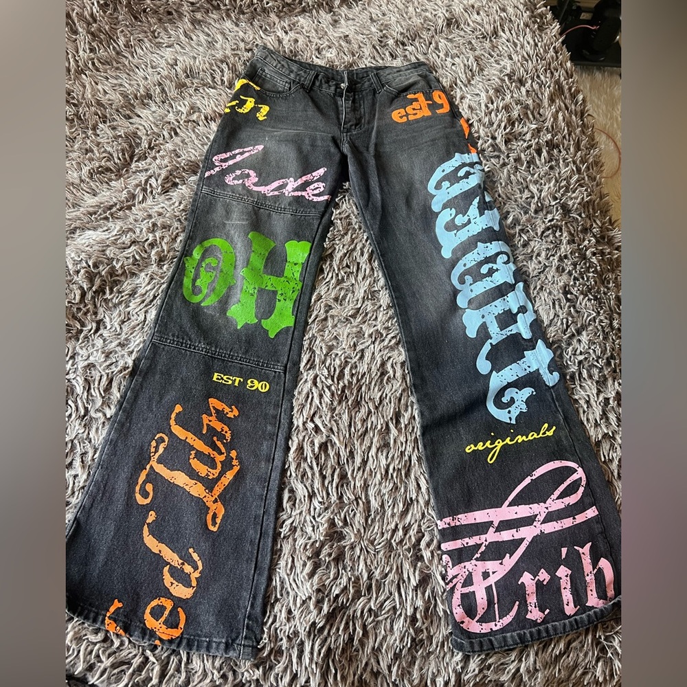 Jaded london sold out black denim with multicolor writing.